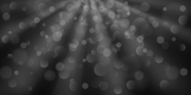 Fondo abstracto en colores negro y gris con rayos divergentes de luz y pequeños círculos translúcidos con efecto bokeh