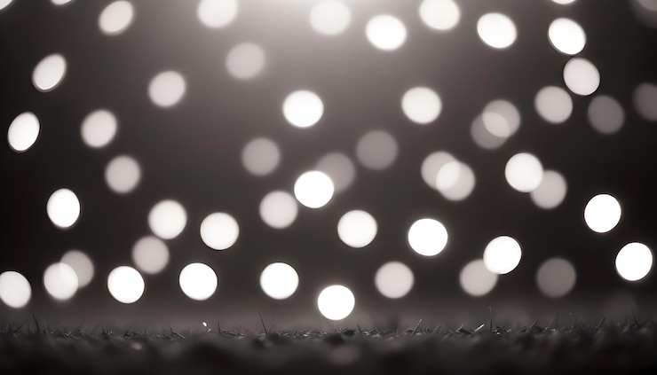 Vector fondo abstracto de luces blancas borrosas sobre un fondo negro las luces están desenfocadas y crean un suave resplandor etéreo