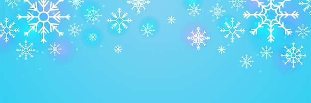 Fondo azul de Navidad con nieve y copos de nieve