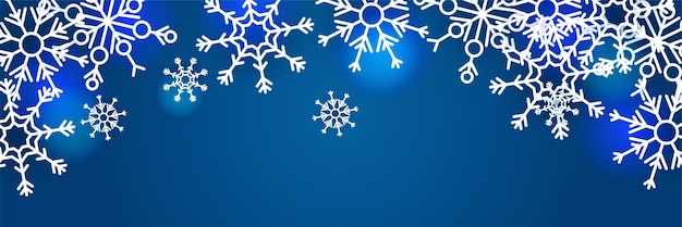 Fondo azul de navidad con nieve y copos de nieve