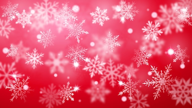 Fondo borroso de Navidad de copos de nieve cayendo grandes y pequeños desenfocados complejos en colores rojos con efecto bokeh