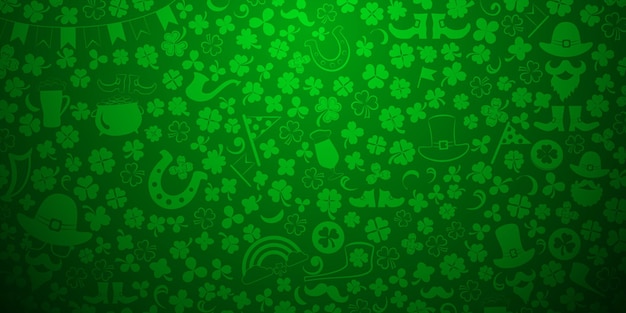 Fondo del día de San Patricio hecho de hojas de trébol y otros símbolos en colores verdes