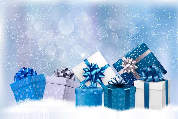 Fondo de Navidad azul con cajas de regalo y copos de nieve.