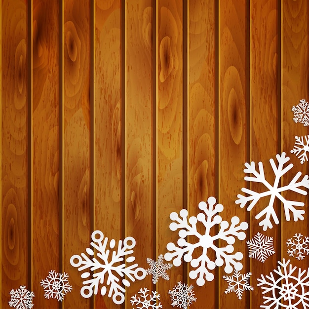 Fondo de Navidad con copos de nieve blancos sobre tablones de madera marrón