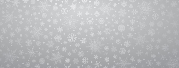 Fondo de navidad de varios copos de nieve grandes y pequeños complejos, en colores grises