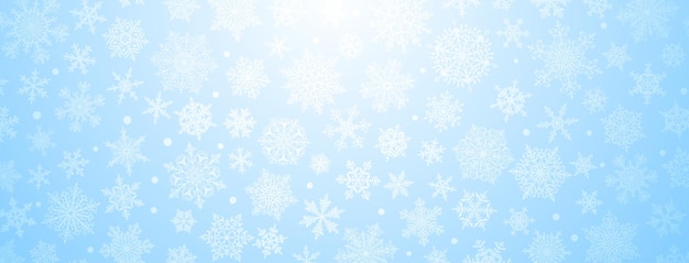 Fondo navideño de copos de nieve complejos grandes y pequeños en colores azul claro