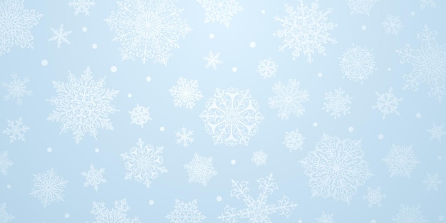 Fondo navideño de copos de nieve complejos grandes y pequeños en colores azul claro