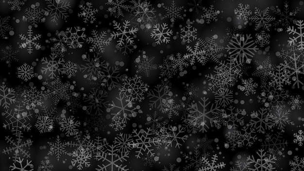 Fondo navideño de copos de nieve de diferentes tamaños de formas y transparencia en colores gris y negro