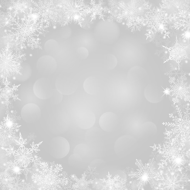 Fondo navideño con marco de copos de nieve en forma de círculo en colores blancos y con efecto bokeh