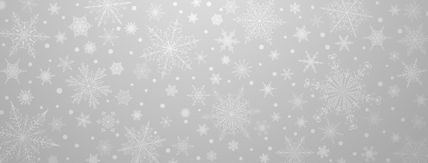 Fondo navideño de varios copos de nieve grandes y pequeños complejos en colores grises