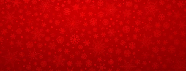 Fondo navideño de varios copos de nieve grandes y pequeños complejos en colores rojos