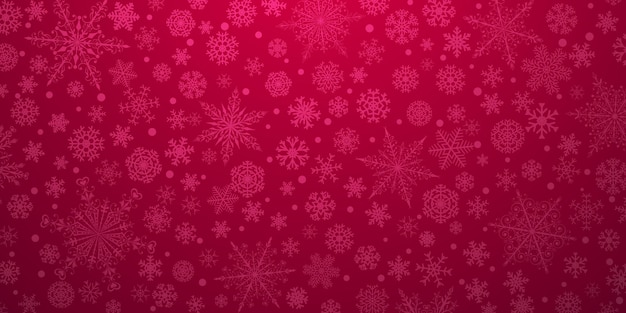 Fondo navideño de varios copos de nieve grandes y pequeños complejos, en colores rojos