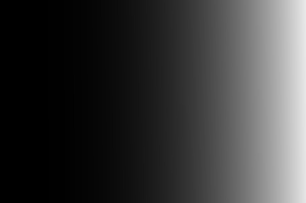 un fondo negro con una luz blanca brillando sobre él