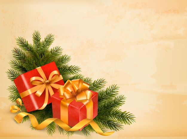 Fondo retro de navidad con ramas de árboles y cajas de regalo