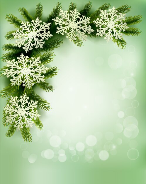 Fondo retro de navidad con ramas de árboles de navidad y copos de nieve