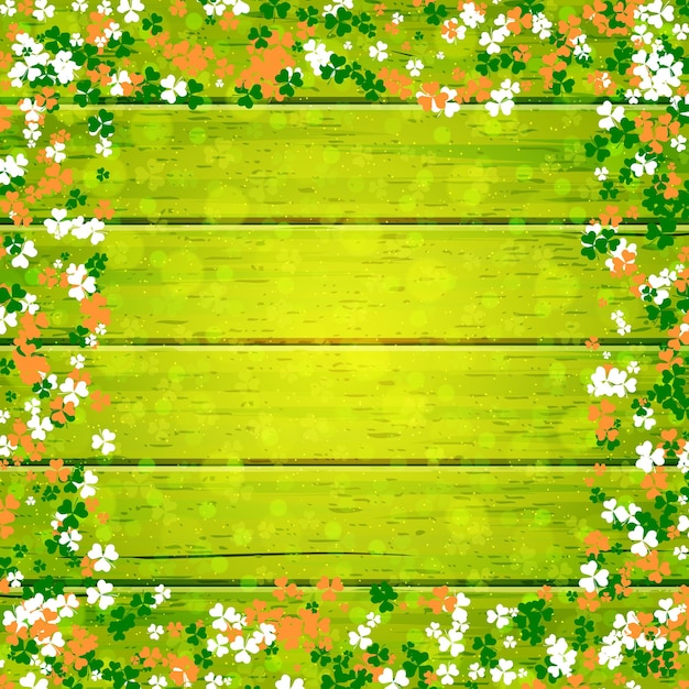 Fondo de vector de madera del día de San Patricio con hojas de trébol de colores