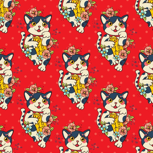 El gato japonés feliz Maneki-neko floreció.