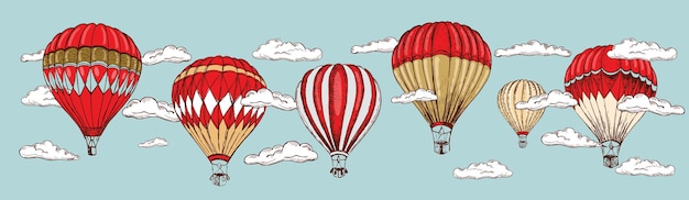 Globos aerostáticos en el cielo con nubes