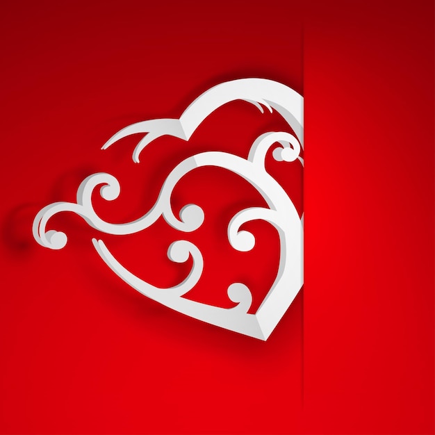 Gran corazón blanco con rizos insertados en un recorte en una hoja de papel rojo