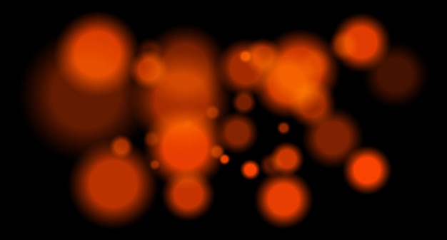 Grandes círculos bokeh de color naranja suave con brillo en fondo negro que crean un campo abstracto soñador adecuado para diseños festivos de ciencia ficción o digitales
