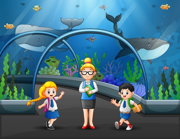 Vector grupo de niños observando peces en la excursión al acuario