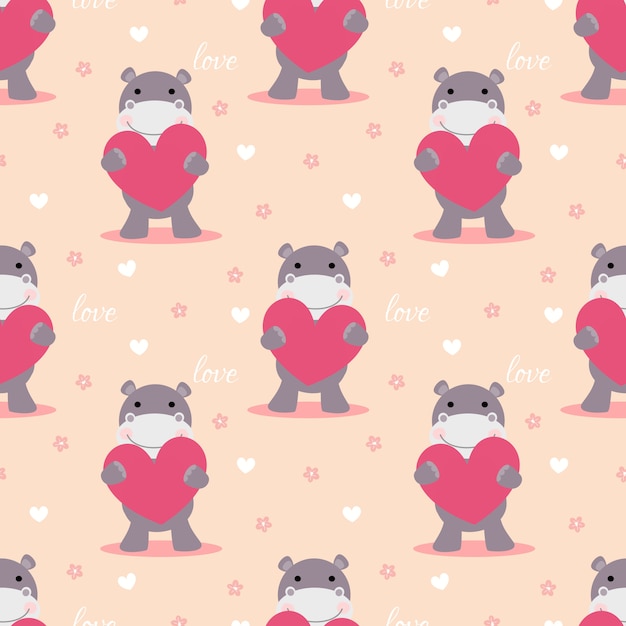 El hipopótamo lindo lleva a cabo un modelo inconsútil del corazón rosado.