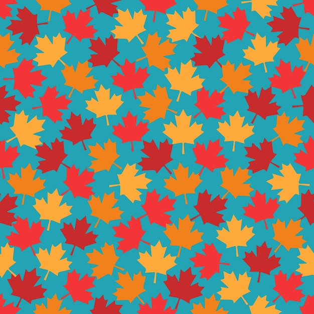 Las hojas de arce de otoño con un patrón sin costuras sobre un fondo azul