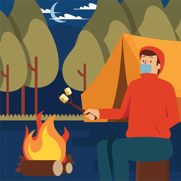 Un hombre asando malvaviscos solo en su campamento