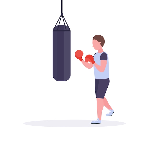 Hombre boxeador haciendo ejercicios con saco de boxeo haciendo un golpe directo en guantes de boxeo rojos entrenamiento de combate de combate de entrenamiento estilo de vida saludable concepto fondo blanco