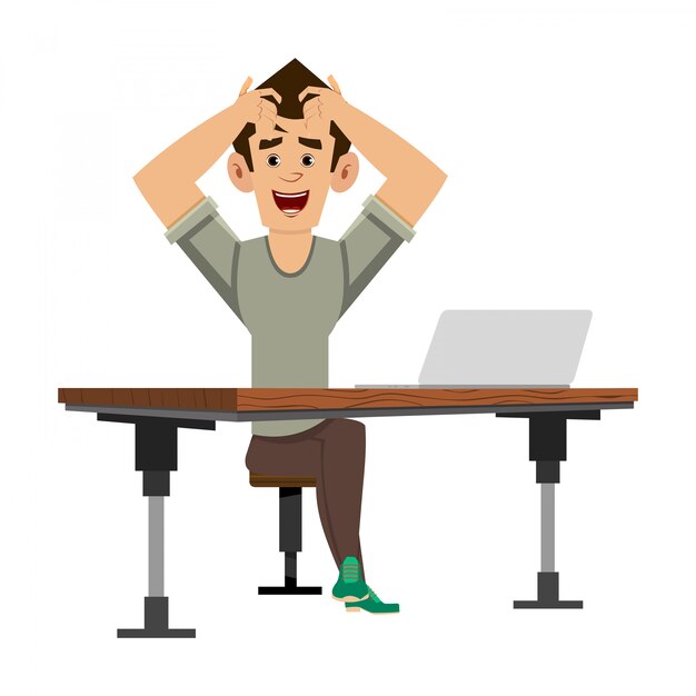 Hombre casual apretando la cabeza con las manos en el escritorio de su computadora