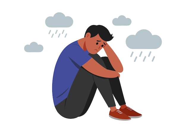 Un hombre deprimido está inmerso en sus pensamientos tristes un hombre frustrado se sienta con los brazos envueltos