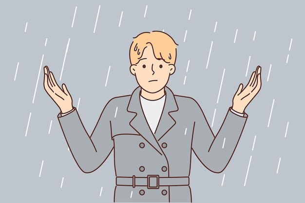El hombre se encuentra bajo la lluvia y extiende los brazos estresados debido a la falta de paraguas y techo sobre la cabeza. la lluvia es metáfora de los problemas para los empresarios que sufren de mal ambiente y comienzo de crisis.