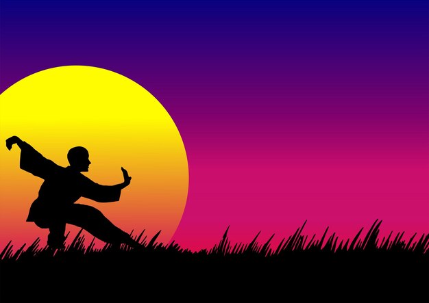 un hombre está sentado en un campo con una puesta de sol en el fondo