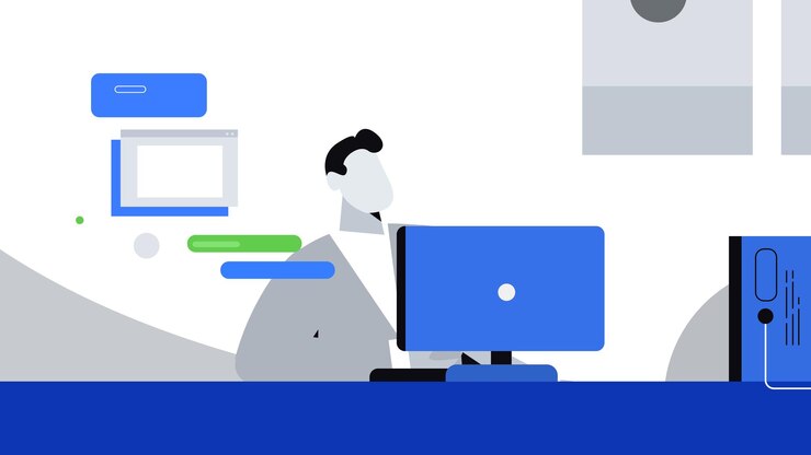 un hombre está trabajando en una computadora con un monitor en un centro de datos