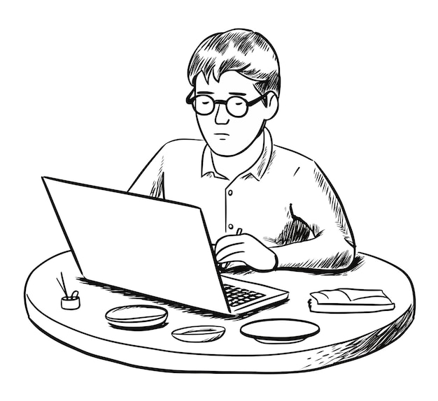 Un hombre está trabajando en una computadora portátil y lleva gafas.