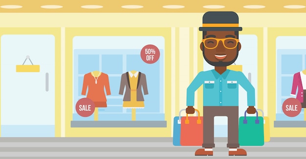 Hombre feliz con bolsas de compras
