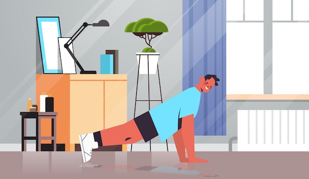 Hombre haciendo ejercicios de flexiones en casa chico tener entrenamiento cardio fitness entrenamiento estilo de vida saludable concepto deportivo sala interior ilustración de cuerpo entero