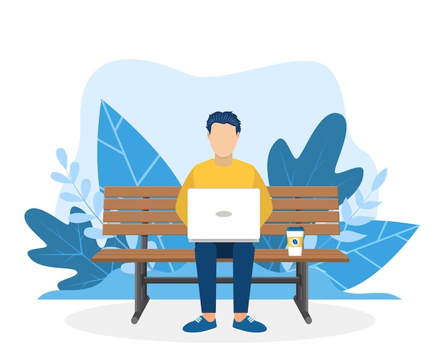 Hombre con laptop sentado en la naturaleza