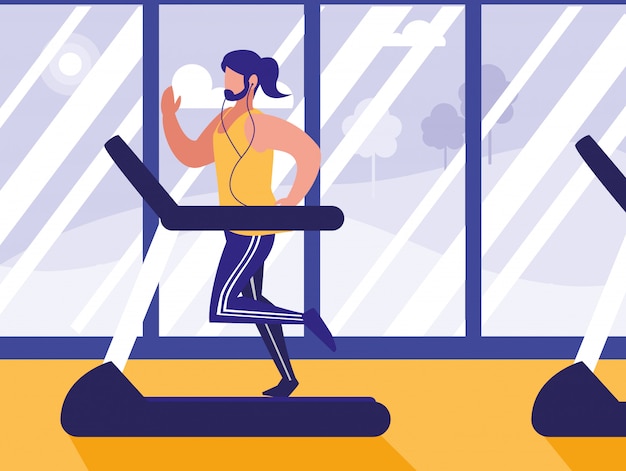 Hombre con máquina de corredor en gimnasio