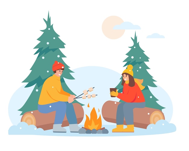 Hombre y mujer felices en el bosque de invierno cerca del fuego clima frío acogedor temporada de invierno nevada actividad al aire libre