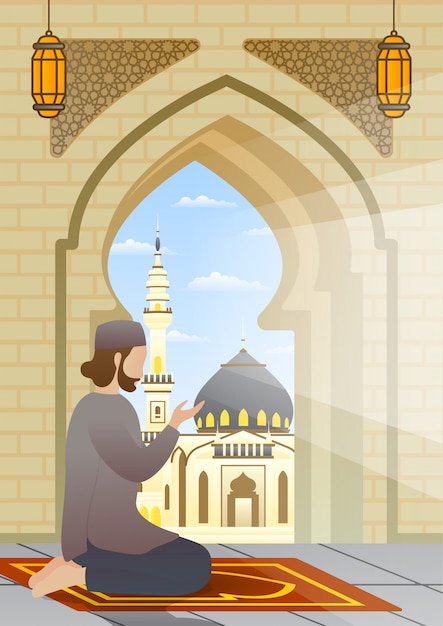Hombre musulmán arrodillado y rezando en la alfombra en la terraza de la mezquita.