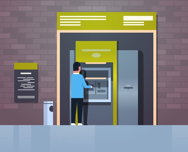 Hombre retirando efectivo a través de cajero automático