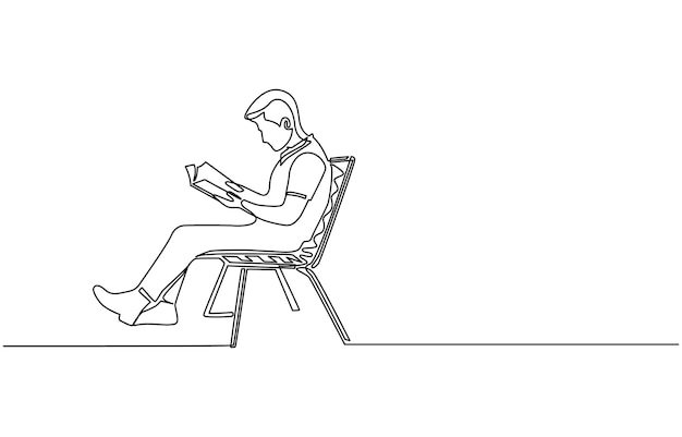 un hombre se sienta en un banco leyendo un libro