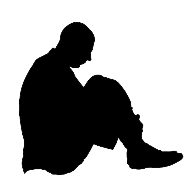 El hombre solitario y triste se sienta en el suelo con las piernas metidas en él experimenta depresión estrés y tristeza Concepto de depresión estrés