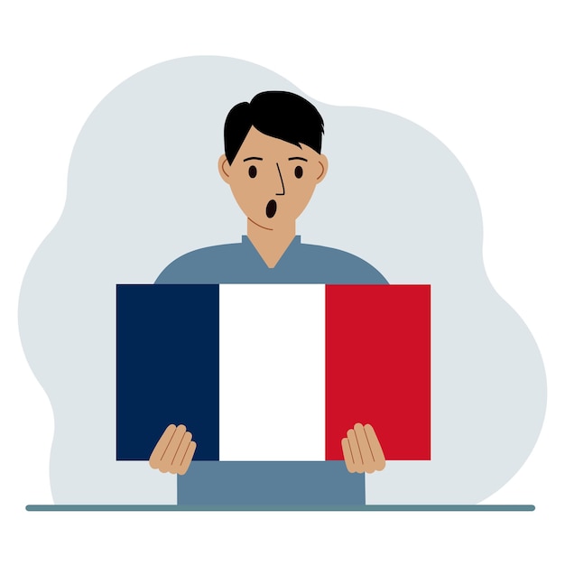 Un hombre sostiene una bandera francesa en sus manos El concepto de fiesta nacional de demostración o patriotismo Nacionalidad