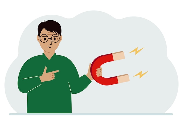 Un hombre sostiene un gran imán en la mano que atrae a nuevos clientes, dinero e ideas. Concepto de generación de leads de tecnologías de marketing empresarial entrante.