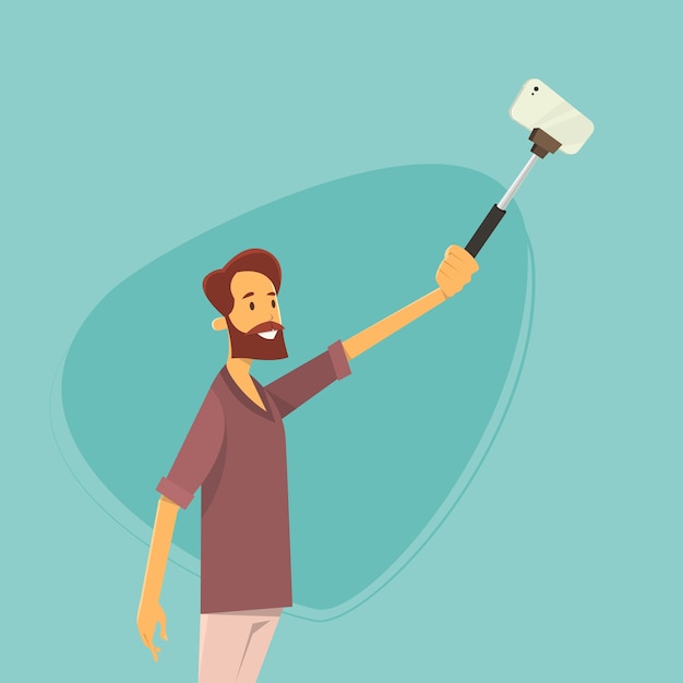 Hombre tomando foto Selfie en teléfono inteligente con palo