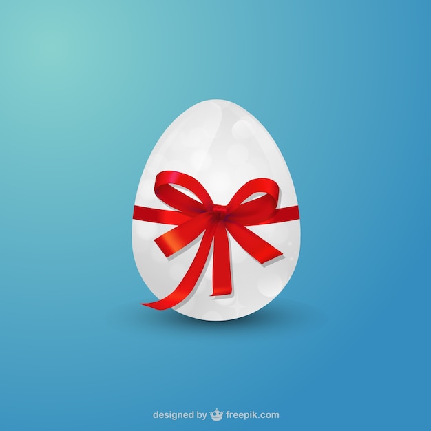 Huevo de pascua con la cinta roja