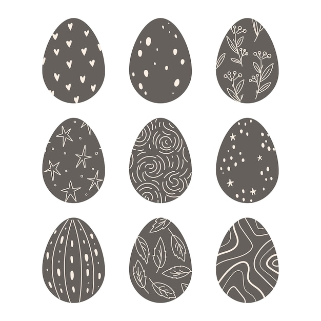 Huevos de Pascua de chocolate oscuro decorados con ornamentación simple Fiestas de primavera Diseño plano