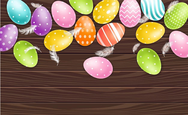 Vector huevos de pascua coloridos en fondo de madera